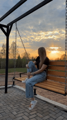 Casual backyard gathering with swing, grilling activities in Kamennoye