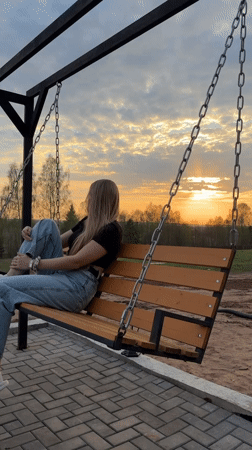 Casual backyard gathering with swing, grilling activities in Kamennoye