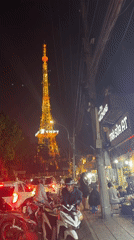 Da Lat's illuminated VNPT tower and church captured at night