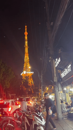Da Lat's illuminated VNPT tower and church captured at night