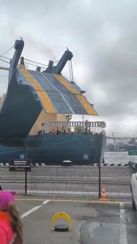 Ferry docked in Vladivostok with loading activity on the ramp