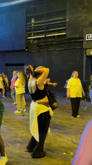 Women dancing at Moscow club with confetti and stage equipment