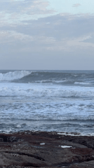 Coastal life documented along Kediri shoreline during sunset transition