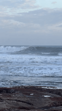 Coastal life documented along Kediri shoreline during sunset transition