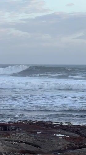 Coastal life documented along Kediri shoreline during sunset transition