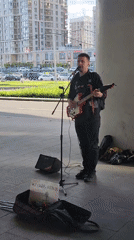 Street musician performs guitar concert under Moscow overpass