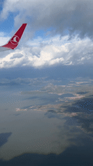 Turkish Airlines passenger films aerial view over Montenegro