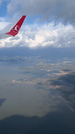 Turkish Airlines passenger films aerial view over Montenegro