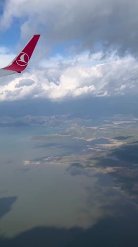 Turkish Airlines passenger films aerial view over Montenegro