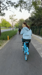Cyclists spotted on paved path in Beijing's Chaoyang District