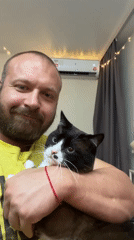 Chill moment with a black and white cat in Noviy, Russia