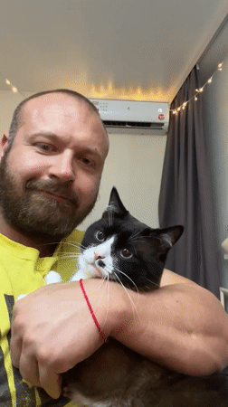 Chill moment with a black and white cat in Noviy, Russia