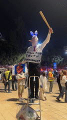 Bunny-eared performer draws Tel Aviv crowd with baseball bat display