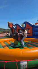 Children enjoy mechanical bull, bungee trampoline activities in Ventspils