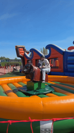Children enjoy mechanical bull, bungee trampoline activities in Ventspils