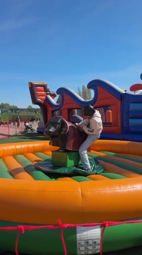 Children enjoy mechanical bull, bungee trampoline activities in Ventspils