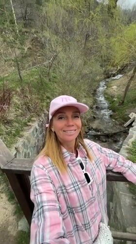 Tourist explores scenic Almaty attractions during morning mountain excursion