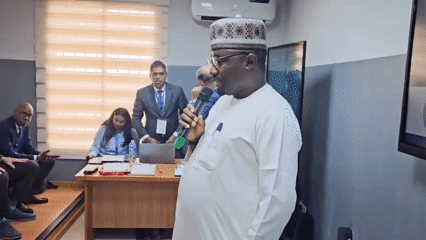 Formal conference in Abuja with speakers and mixed-dress audience