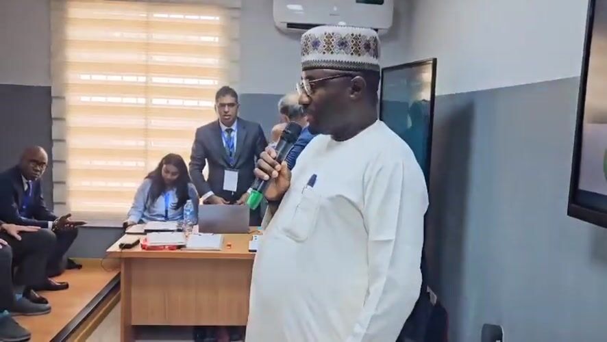 Formal conference in Abuja with speakers and mixed-dress audience