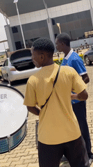 Musicians perform outdoors near arrivals building in Nigeria