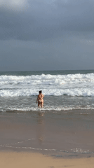 Surfers brave stormy conditions at Sri Lankan beaches