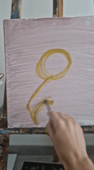 Artist paints tulip flower on canvas during early morning session