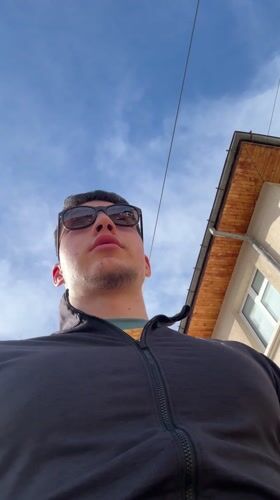 Young man films selfies outside in sunny Zlatograd
