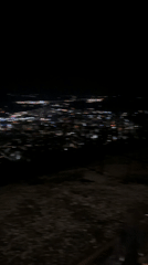 Nighttime city lights captured from elevated viewpoint in Shumen