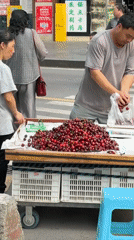 Street vendors sell cherries, vegetables in Yuzhong District