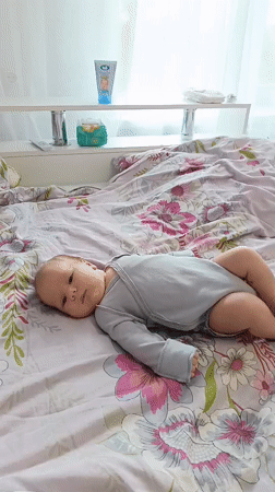 Baby observed resting on floral bed in Andreyevo