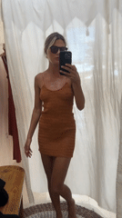 Woman tries on dresses, takes mirror selfies in North Kuta
