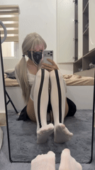 Mirror selfie on a grey rug, bold styling choices