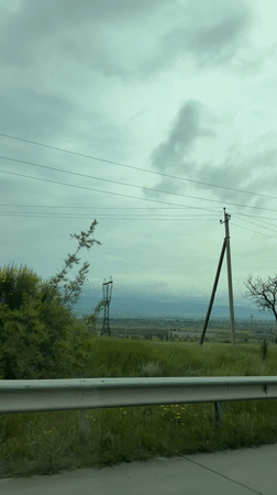 Couple's highway journey documented near Tserovani, Georgia