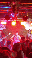Live band performs at Puebla restaurant with dancing crowd