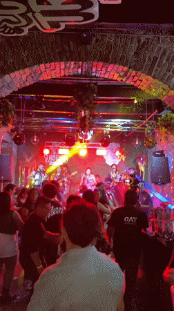 Live band performs at Puebla restaurant with dancing crowd