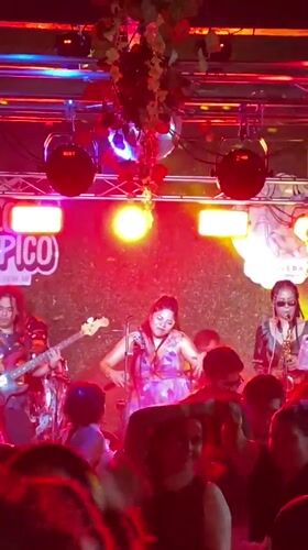 Live band performs at Puebla restaurant with dancing crowd