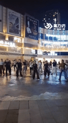 Group performs synchronized line dancing in Chongqing public plaza