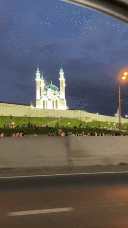 Evening gathering at illuminated Kul Sharif Mosque in Kazan