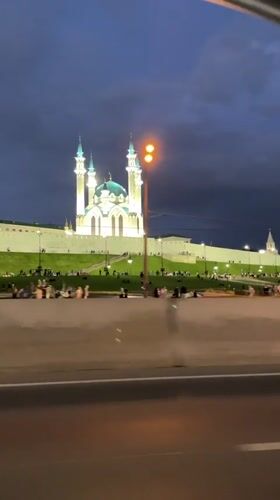 Evening gathering at illuminated Kul Sharif Mosque in Kazan