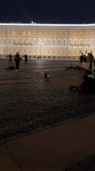 Evening tourist activity captured around Palace Square, Saint Petersburg