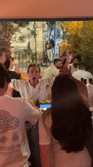 Nighttime social gathering with DJ captured in Tel-Aviv