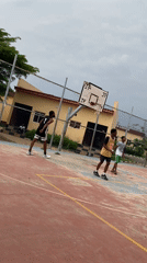 Young men play basketball on outdoor court in Lagos