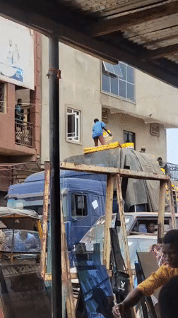 Morning street life and goods movement in Maiburiji, Nigeria