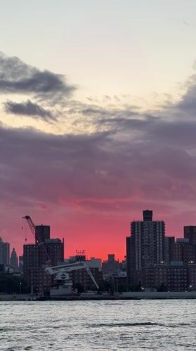 Dramatic sunset paints NYC skyline in vibrant colors