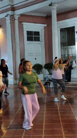 Nighttime outdoor fitness class held in Barranco, Peru