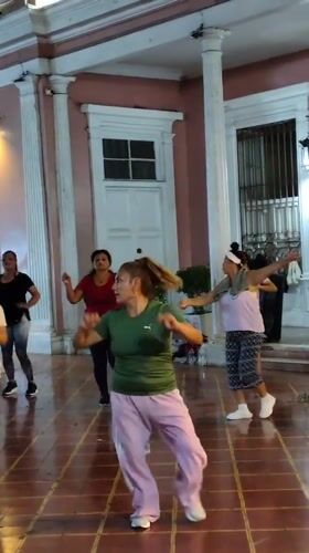 Nighttime outdoor fitness class held in Barranco, Peru