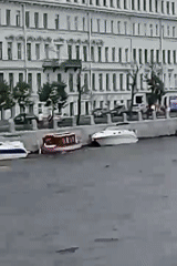 Canal boats, carved sculptures, and classic architecture in St. Petersburg
