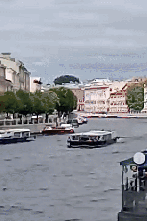 Canal boats, carved sculptures, and classic architecture in St. Petersburg