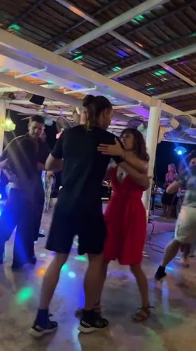 Couples dance at outdoor venue in Baan Tai, Thailand