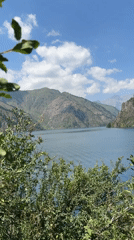 Quiet alpine lake in the Kyrgyz mountains on a clear morning